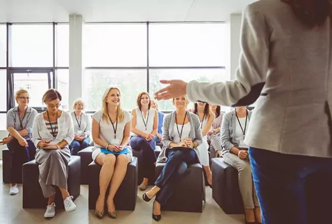 industrial-psychologist-giving-a-speech-to-group-of-people-704x421